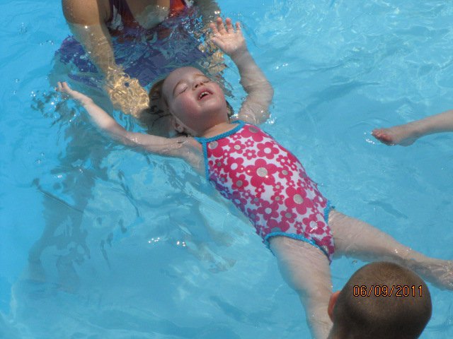 Swim lessons - girl floating